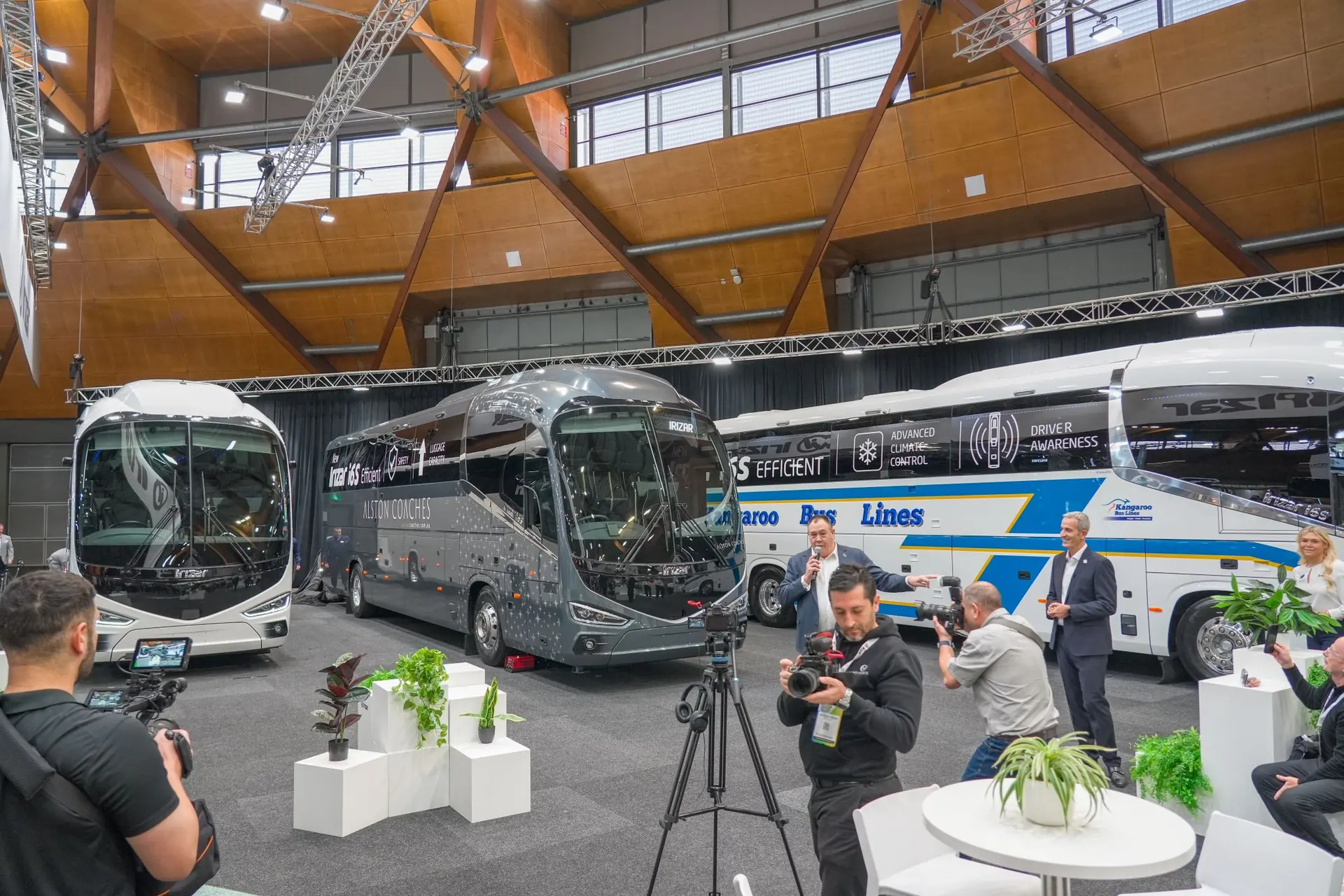 An Irizar i6S Efficient coach in Alston livery on a show floor